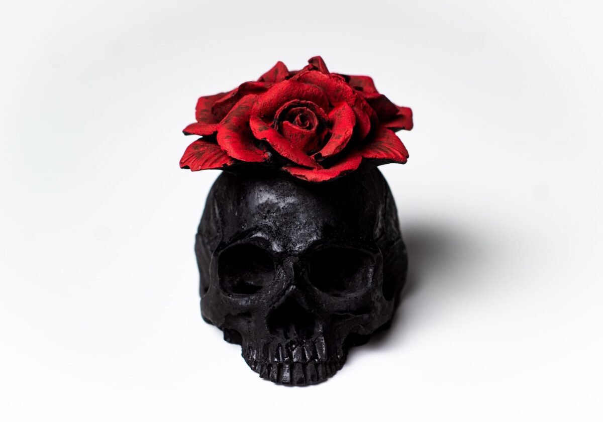 Red flower skull concrete ornament